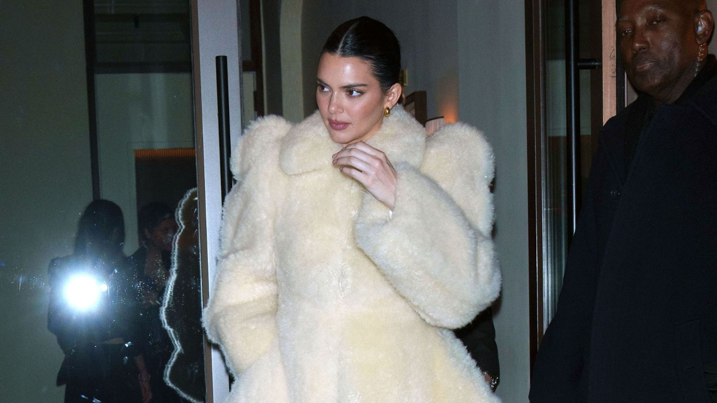 Kendall Jenner wearing a white faux fur coat