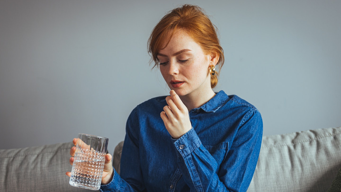 Woman taking pill